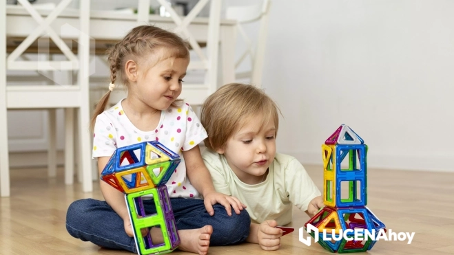boy girl home playing with toys together boy girl home playing with toys together