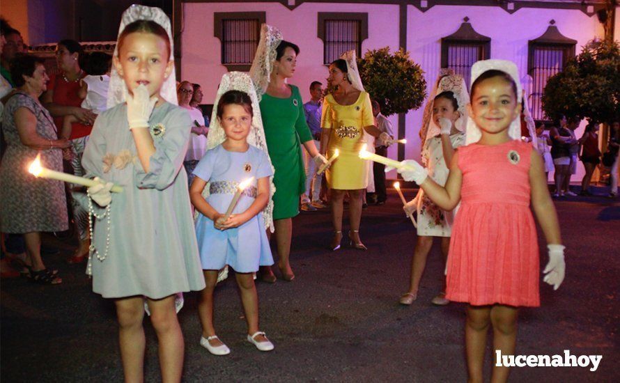 Galería: La Virgen del Carmen, de nuevo bajo palio, recorre con brillantez las calles de su barrio en solemne procesión