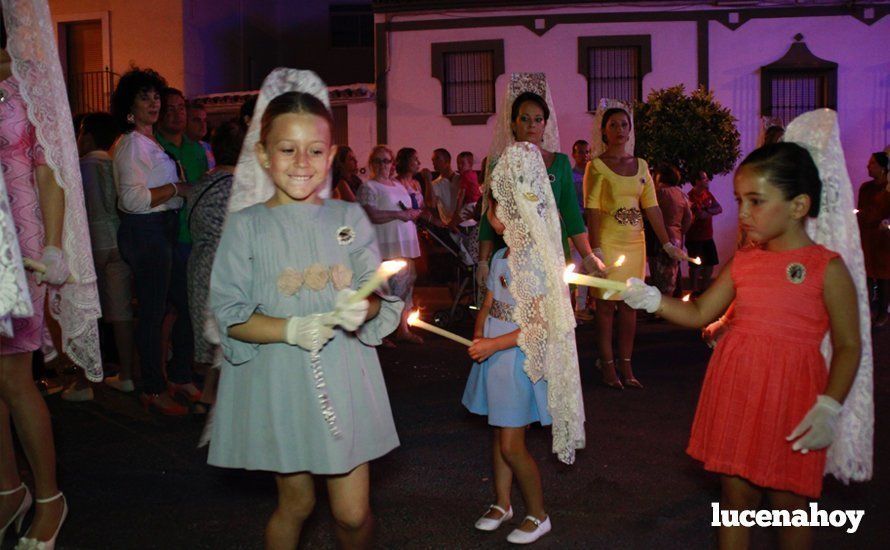 Galería: La Virgen del Carmen, de nuevo bajo palio, recorre con brillantez las calles de su barrio en solemne procesión