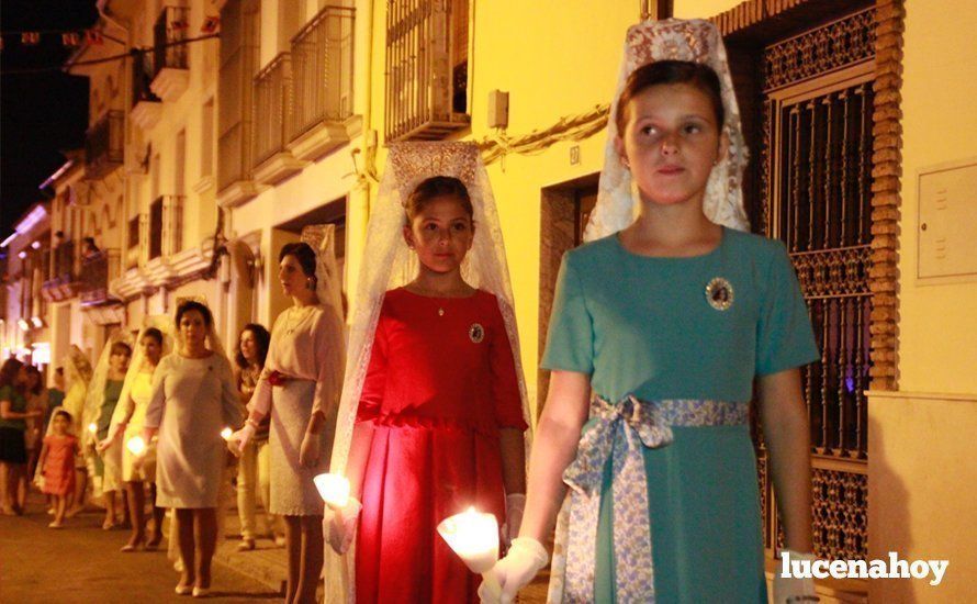 Galería: La Virgen del Carmen, de nuevo bajo palio, recorre con brillantez las calles de su barrio en solemne procesión