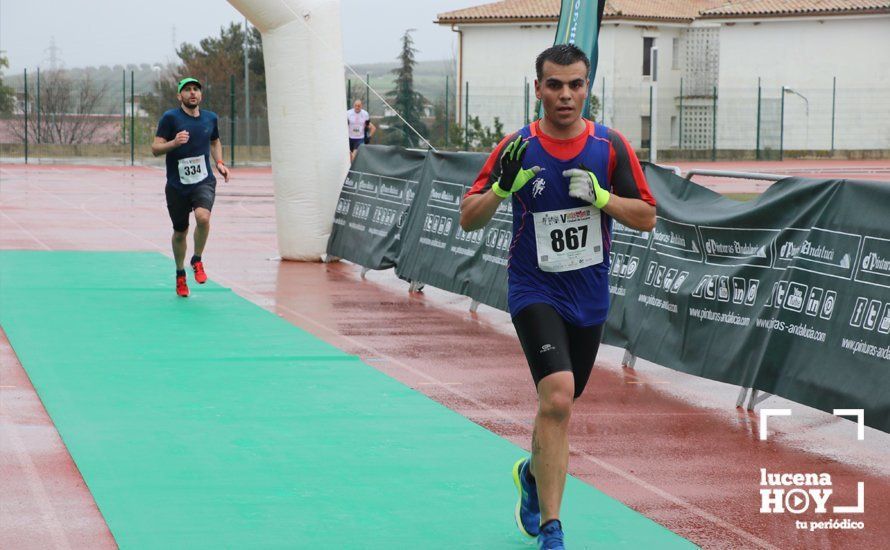 GALERÍA: Mounir Elouardi y Nazha Machrouh repiten reinado bajo el diluvio en la Media Maraton de Lucena