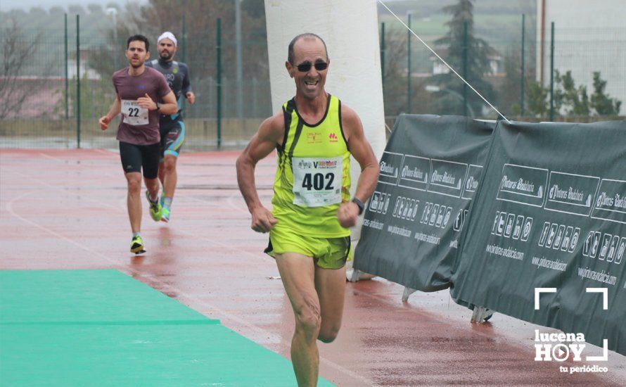 GALERÍA: Mounir Elouardi y Nazha Machrouh repiten reinado bajo el diluvio en la Media Maraton de Lucena