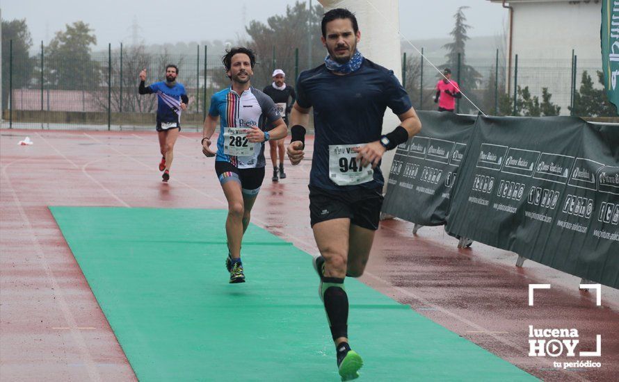 GALERÍA: Mounir Elouardi y Nazha Machrouh repiten reinado bajo el diluvio en la Media Maraton de Lucena