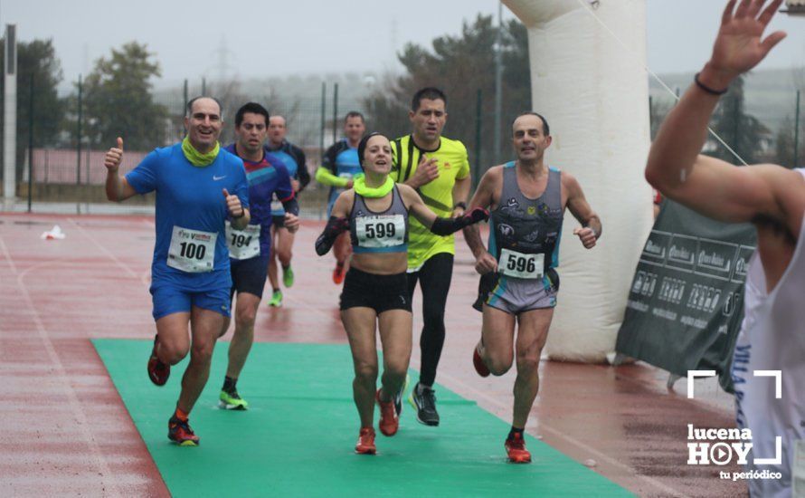 GALERÍA: Mounir Elouardi y Nazha Machrouh repiten reinado bajo el diluvio en la Media Maraton de Lucena