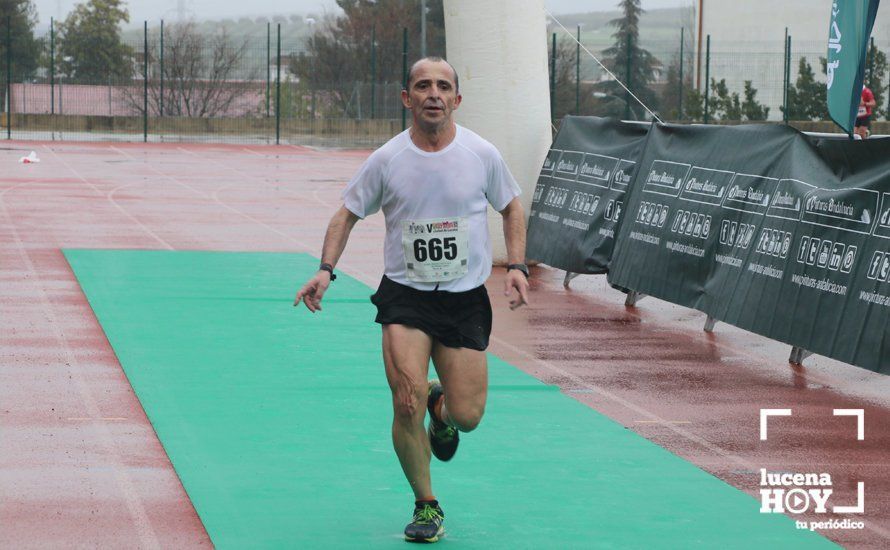 GALERÍA: Mounir Elouardi y Nazha Machrouh repiten reinado bajo el diluvio en la Media Maraton de Lucena