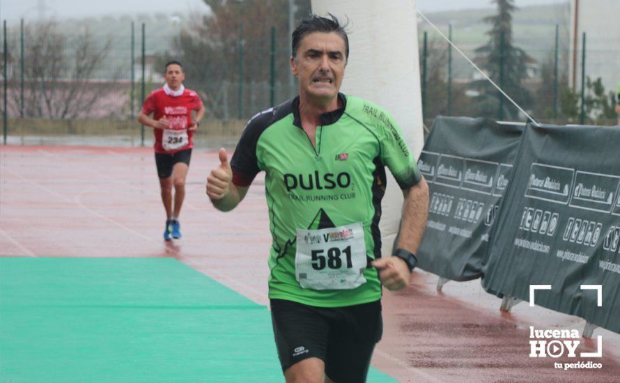 GALERÍA: Mounir Elouardi y Nazha Machrouh repiten reinado bajo el diluvio en la Media Maraton de Lucena