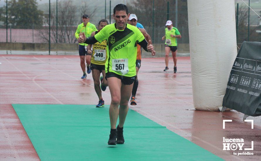 GALERÍA: Mounir Elouardi y Nazha Machrouh repiten reinado bajo el diluvio en la Media Maraton de Lucena