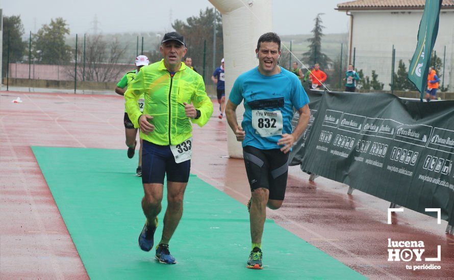 GALERÍA: Mounir Elouardi y Nazha Machrouh repiten reinado bajo el diluvio en la Media Maraton de Lucena