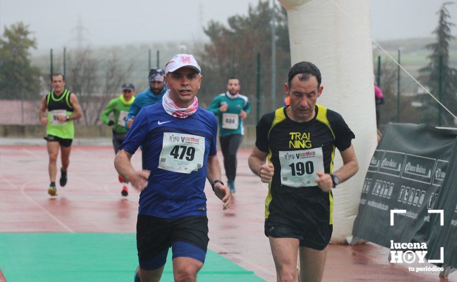 GALERÍA: Mounir Elouardi y Nazha Machrouh repiten reinado bajo el diluvio en la Media Maraton de Lucena