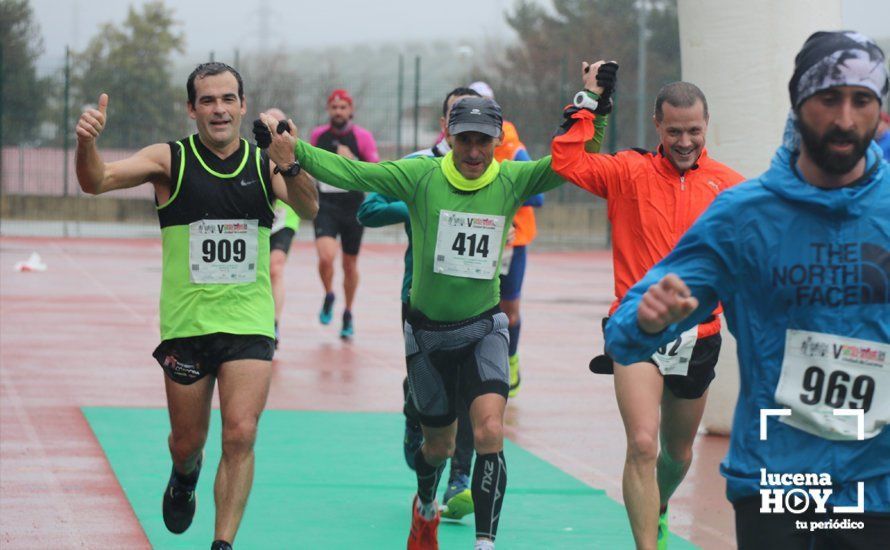 GALERÍA: Mounir Elouardi y Nazha Machrouh repiten reinado bajo el diluvio en la Media Maraton de Lucena