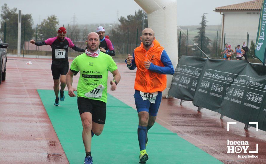 GALERÍA: Mounir Elouardi y Nazha Machrouh repiten reinado bajo el diluvio en la Media Maraton de Lucena