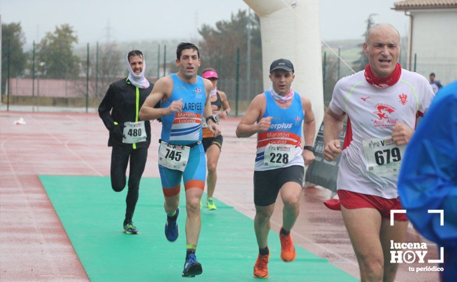 GALERÍA: Mounir Elouardi y Nazha Machrouh repiten reinado bajo el diluvio en la Media Maraton de Lucena