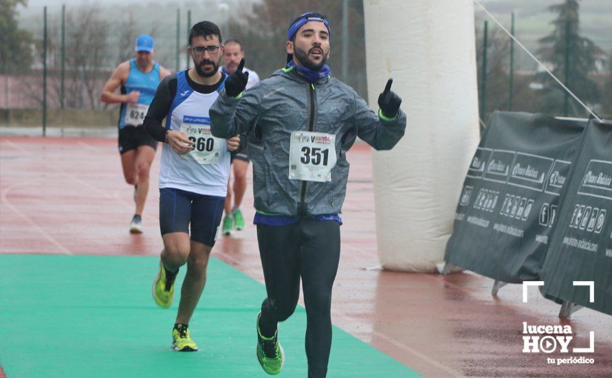 GALERÍA: Mounir Elouardi y Nazha Machrouh repiten reinado bajo el diluvio en la Media Maraton de Lucena