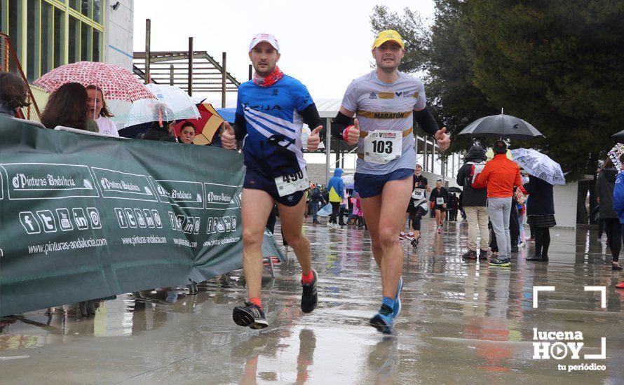 GALERÍA: Mounir Elouardi y Nazha Machrouh repiten reinado bajo el diluvio en la Media Maraton de Lucena