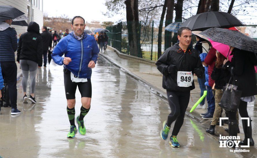 GALERÍA: Mounir Elouardi y Nazha Machrouh repiten reinado bajo el diluvio en la Media Maraton de Lucena