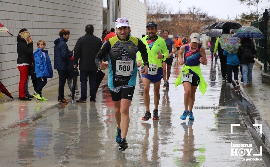 GALERÍA: Mounir Elouardi y Nazha Machrouh repiten reinado bajo el diluvio en la Media Maraton de Lucena