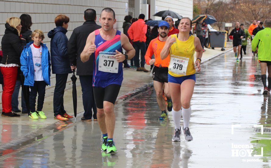 GALERÍA: Mounir Elouardi y Nazha Machrouh repiten reinado bajo el diluvio en la Media Maraton de Lucena