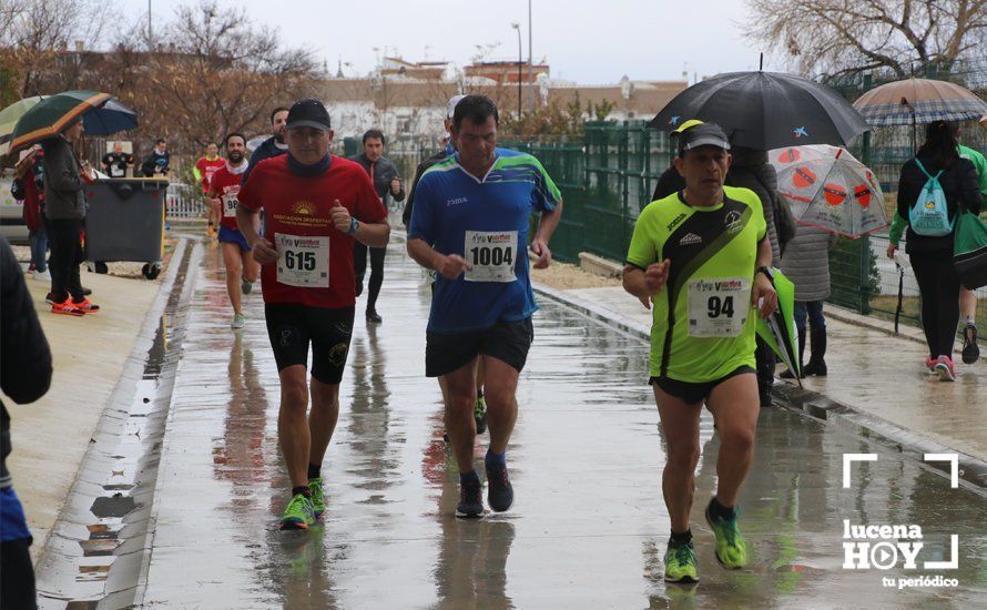 GALERÍA: Mounir Elouardi y Nazha Machrouh repiten reinado bajo el diluvio en la Media Maraton de Lucena