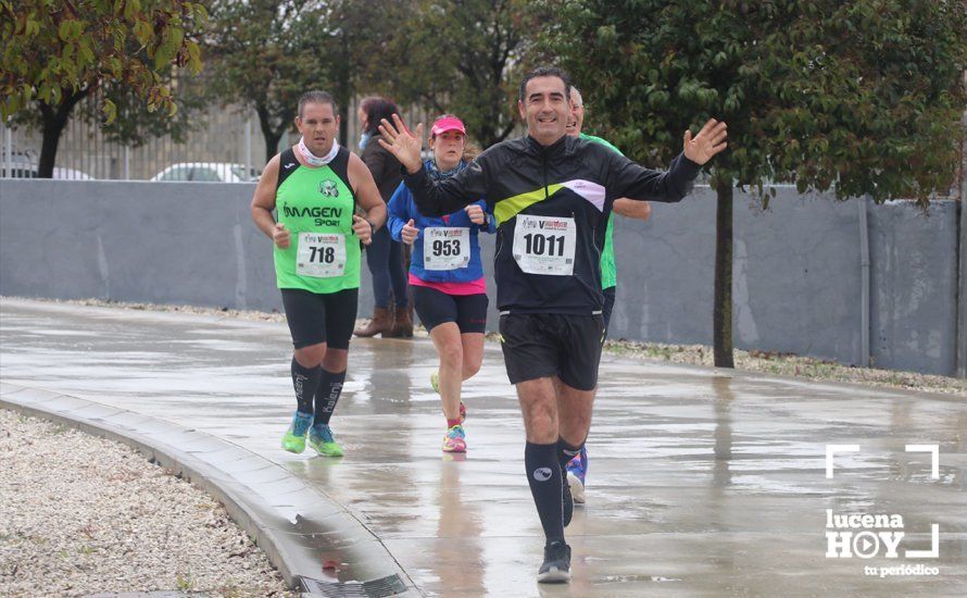 GALERÍA: Mounir Elouardi y Nazha Machrouh repiten reinado bajo el diluvio en la Media Maraton de Lucena