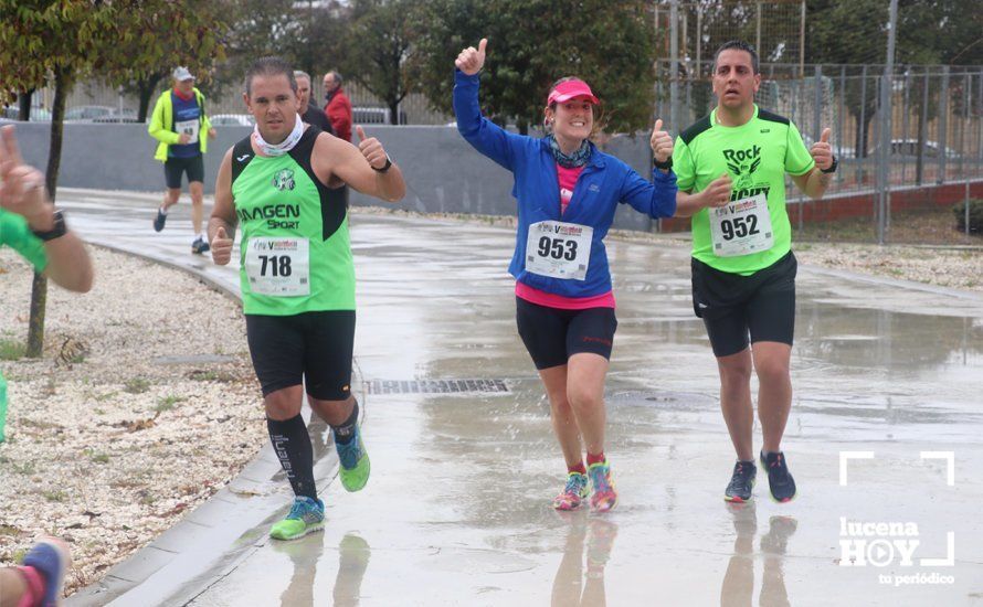 GALERÍA: Mounir Elouardi y Nazha Machrouh repiten reinado bajo el diluvio en la Media Maraton de Lucena