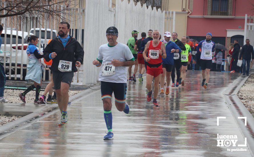 GALERÍA: Mounir Elouardi y Nazha Machrouh repiten reinado bajo el diluvio en la Media Maraton de Lucena