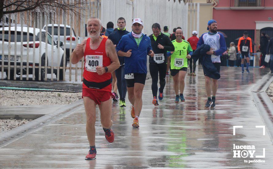 GALERÍA: Mounir Elouardi y Nazha Machrouh repiten reinado bajo el diluvio en la Media Maraton de Lucena