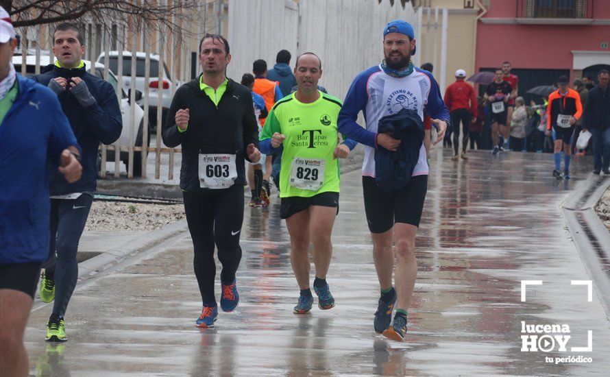 GALERÍA: Mounir Elouardi y Nazha Machrouh repiten reinado bajo el diluvio en la Media Maraton de Lucena