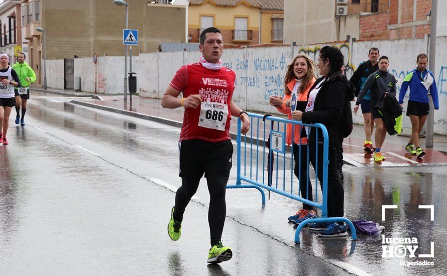 GALERÍA: Mounir Elouardi y Nazha Machrouh repiten reinado bajo el diluvio en la Media Maraton de Lucena