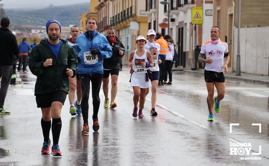 GALERÍA: Mounir Elouardi y Nazha Machrouh repiten reinado bajo el diluvio en la Media Maraton de Lucena